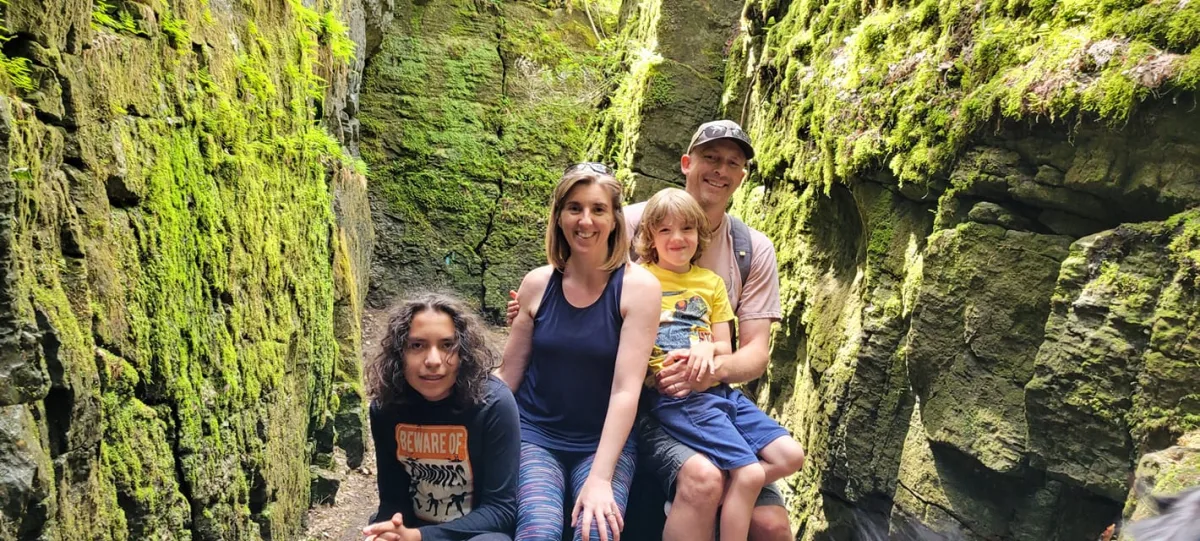 Paul with his wife Lisa and their two boys, hiking a canyon trail near Collingwood